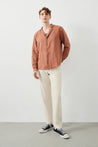 Great Summer Look for Men: Ra Denim Tenedos Brown Linen Shirt paired with ecru trousers and black converse