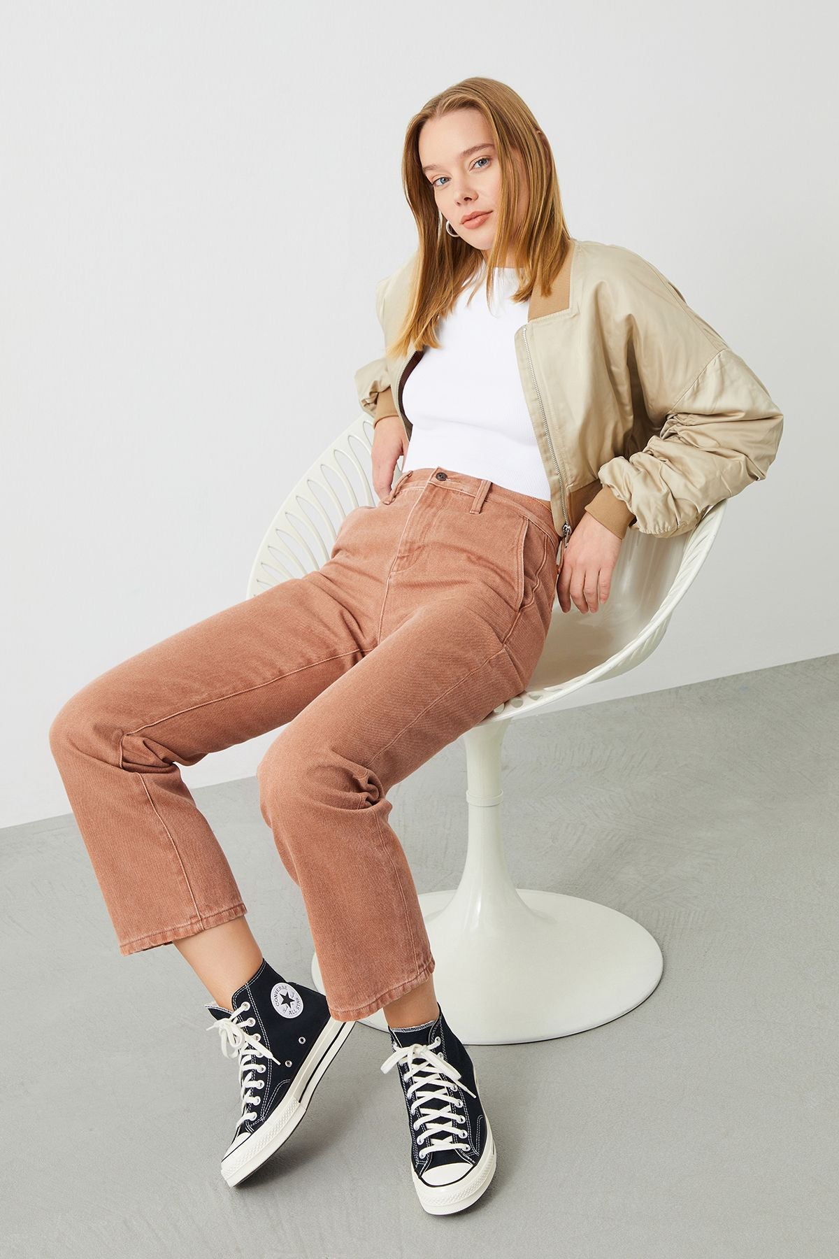 Stylish woman wearing the Mira Boyfriend Fit Chino Pant in Terracotta