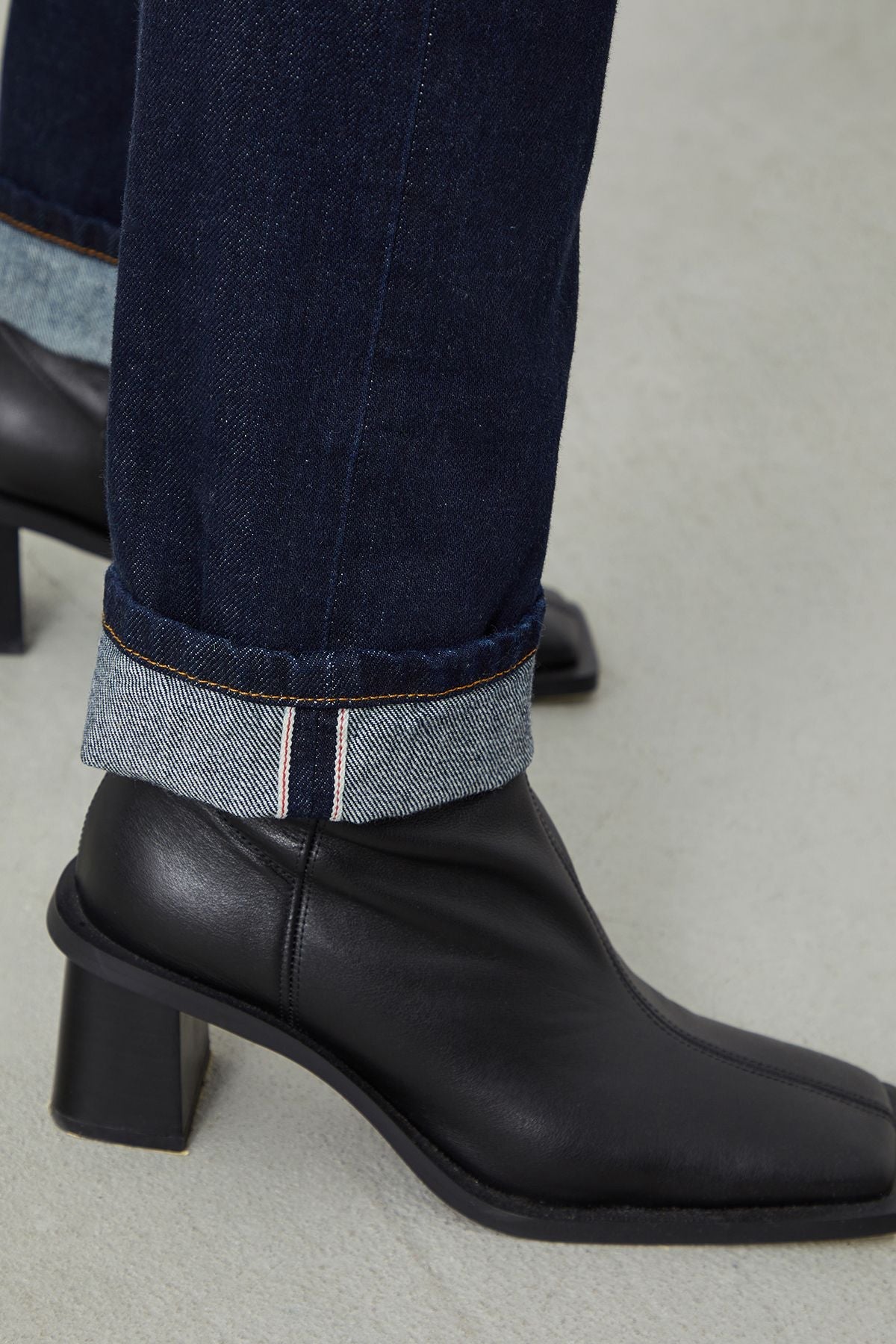 Detail shot of the cuff on MIRA Boyfriend Fit Dark Blue Selvedge Women's Jeans, showcasing their clean finish